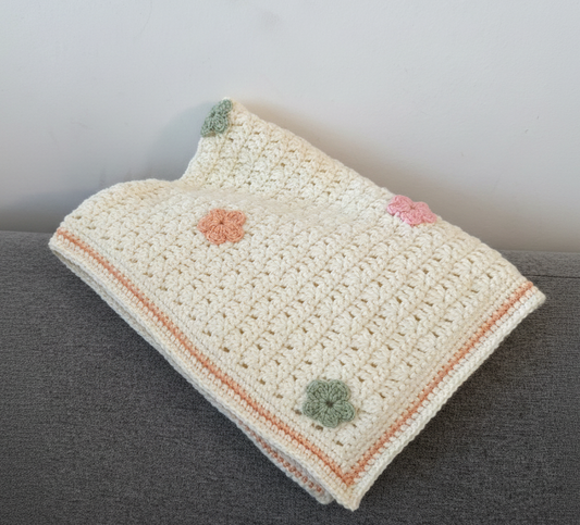 Crochet baby blanket with flowers